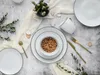 A flat lay of a dinnerware set with a bowl of food, cutlery, and a mug. Náhľad obrázku produktu