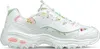 A single white sneaker with a floral pattern is shown against a white background. Produktbild-Vorschau