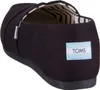 A close-up side view of a black Toms shoe. Voir les images du produit