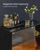 A bar setup on a black cabinet with bottles of alcohol, glasses, and a vase of flowers. Produktbild-Vorschau