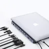 A laptop docking station with multiple cables connected to it, placed on a white background. Produktbild-Vorschau