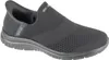A black Skechers slip-on sneaker is shown from the side against a white background. Voir les images du produit