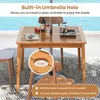 A wooden table with an umbrella hole, set outdoors near a pool. Produktbild-Vorschau