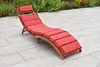 A red chaise lounge chair on a patio. Produktbild-Vorschau