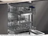 Interior view of an open dishwasher with two racks pulled out. Náhled obrázku produktu