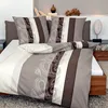 A neatly made bed with bedding featuring a paisley and striped pattern. Produktbild-Vorschau