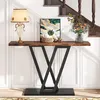 A console table with decorative items placed on it, situated in a hallway with stairs. Podgląd zdjęcia produktu