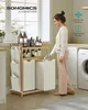 A woman is using a bamboo laundry basket with multiple compartments and shelves in a laundry room setting. Produktbild-Vorschau
