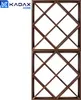 A dark brown wooden wine rack with a grid pattern, shown against a white background. Voir les images du produit