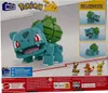 The image shows the packaging of a Mega Construx Pokemon Jumbo Bulbasaur building set. The front of the packaging features a large image of the assembled Bulbasaur model, along with smaller images of other Pokemon figures and promotional text. Produktbild-Vorschau