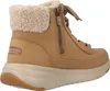 A side view of a brown Skechers boot with a fluffy lining. Voir les images du produit
