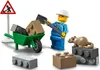 A Lego construction worker minifigure is shown with a wheelbarrow full of bricks, a shovel, and a rat sitting on some bricks. Produktbild-Vorschau