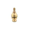 A close-up studio shot of a brass faucet cartridge on a white background. Anteprima dell’immagine prodotto