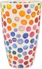 A close-up, straight-on view of a ceramic mug with a colorful polka dot pattern. Produktbild-Vorschau