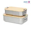 Two stacked stainless steel lunchboxes with bamboo lids. Anteprima dell’immagine prodotto