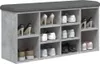A shoe bench with multiple compartments filled with shoes. Anteprima dell’immagine prodotto