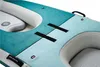 A close-up view of the deck of an inflatable kayak, showing the textured surface, handles, and seating areas. Voir les images du produit