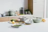 A collection of cookware arranged on a kitchen counter. Anteprima dell’immagine prodotto
