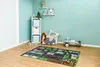 A child's playroom with a rug, toy storage, and a ride-on toy. Produktbild-Vorschau