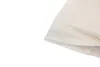 A close-up of a folded cream-colored fabric, likely a blanket or bedding. Produktbild-Vorschau