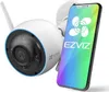 A white EZVIZ smart home camera is shown next to a smartphone displaying the EZVIZ app. Anteprima dell’immagine prodotto