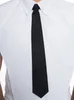 A close-up shot of a person wearing a white shirt and a black tie. Produktbild-Vorschau