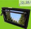 A black window frame is shown against a green background, with a scenic view of mountains and trees visible through the glass. Produktbild-Vorschau