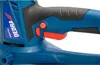 Close-up of the handle and controls of a blue power tool. Náhled obrázku produktu