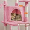 A cat sleeping in a pink cat tree condo. Podgląd zdjęcia produktu