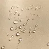 A close-up view of water droplets on a textured fabric surface. Produktbild-Vorschau