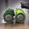 A close-up illustration of vacuum cleaner rollers picking up debris. Náhled obrázku produktu