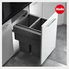 A pull-out kitchen waste bin system with two compartments inside a cabinet. Voir les images du produit