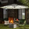 An outdoor patio scene with a large cantilever umbrella, chairs, a fire pit, and a table. Voir les images du produit