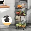 Schwarzer 3-stufiger rollbarer Utility-Wagen mit Lenkrollen, gefüllt mit Produkten und Kartons, in einer Küche Náhľad obrázku produktu