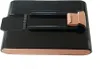 A black and copper colored battery pack for a vacuum cleaner, shown from a slightly elevated angle on a white background. Produktbild-Vorschau