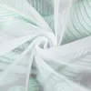 A close-up view of white sheer fabric with a subtle green leaf pattern. Produktbild-Vorschau