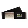 A black fabric belt with a silver buckle and a small green crocodile logo. Anteprima dell’immagine prodotto
