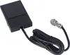 A black foot pedal switch with a coiled black cable and a silver connector, isolated on a white background. Náhled obrázku produktu