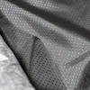 A close-up view of the underside of a dog bed, showing a textured fabric with small, raised dots. Anteprima dell’immagine prodotto