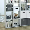 A white shelving unit filled with various storage boxes and books. Náhled obrázku produktu