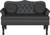 A black Chesterfield sofa with two round cushions. Náhľad obrázku produktu