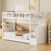 A white bunk bed with a pull-out trundle bed is set up in a child's bedroom, with bedding and decorative pillows. Produktbild-Vorschau