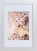 A framed picture of a woman adorned with roses. Produktbild-Vorschau