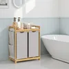 A bathroom scene with a laundry hamper and a bathtub. Produktbild-Vorschau