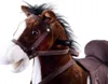 Close-up of a brown plush rocking horse with a white blaze on its face and a brown saddle. Voir les images du produit