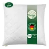 A white quilted pillow with a green band down the center featuring brand logos and certifications. Produktbild-Vorschau