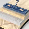 A mop head is shown on a layered surface representing different flooring types. Anteprima dell’immagine prodotto