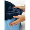 Hands folding a dark blue liner inside a light blue pool. Produktbild-Vorschau
