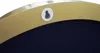 A close-up view of the back of a round mirror frame, showing a hanging hook. Náhled obrázku produktu