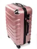 A rose gold suitcase is shown against a white background. Náhled obrázku produktu